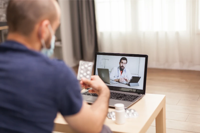 Adult man talking with doctor about medication treatment