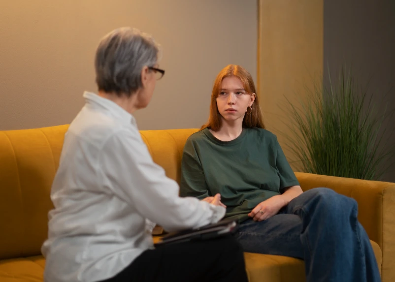 Adult in a therapy session receiving compassionate mental health care
