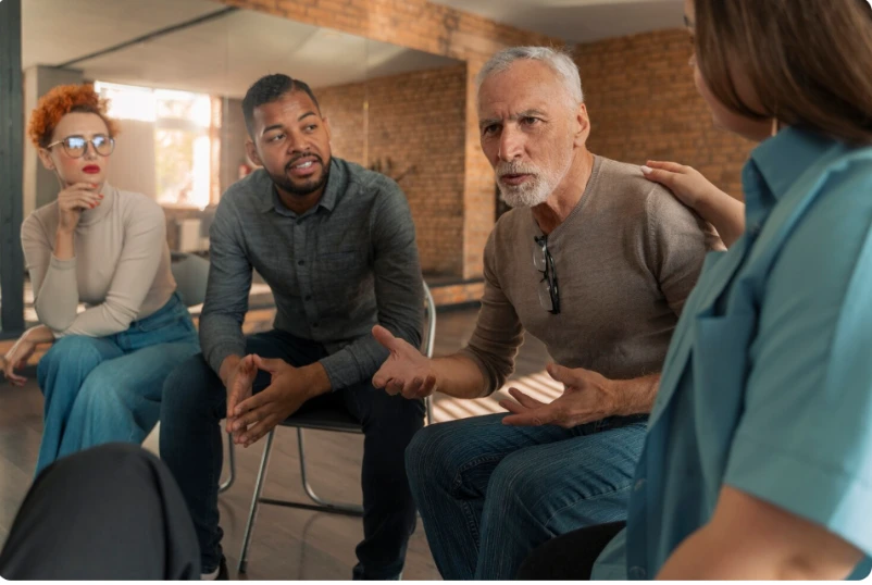 Diverse people in mental health support session