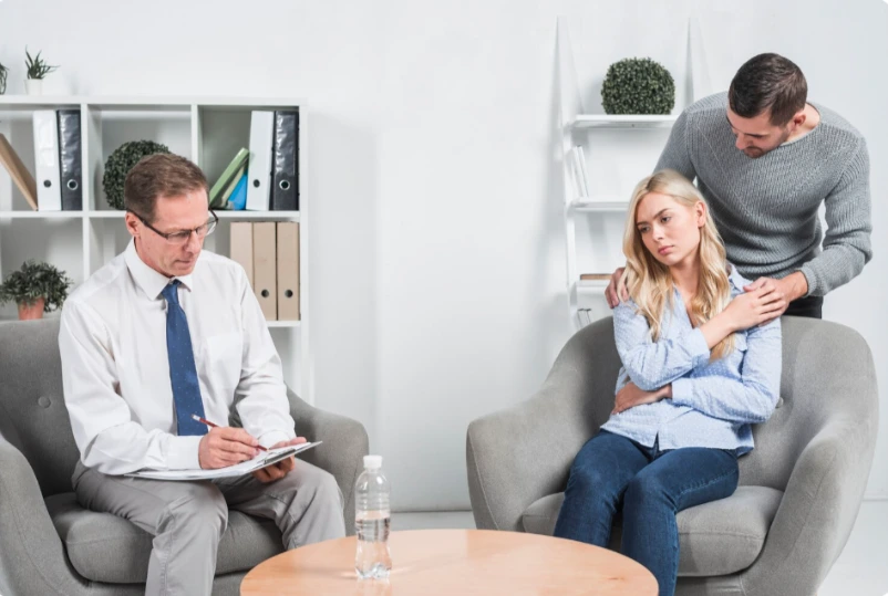 Psychiatrist writing notes during patient consultation