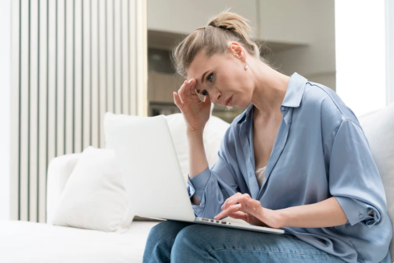 Woman writing notes during therapy session